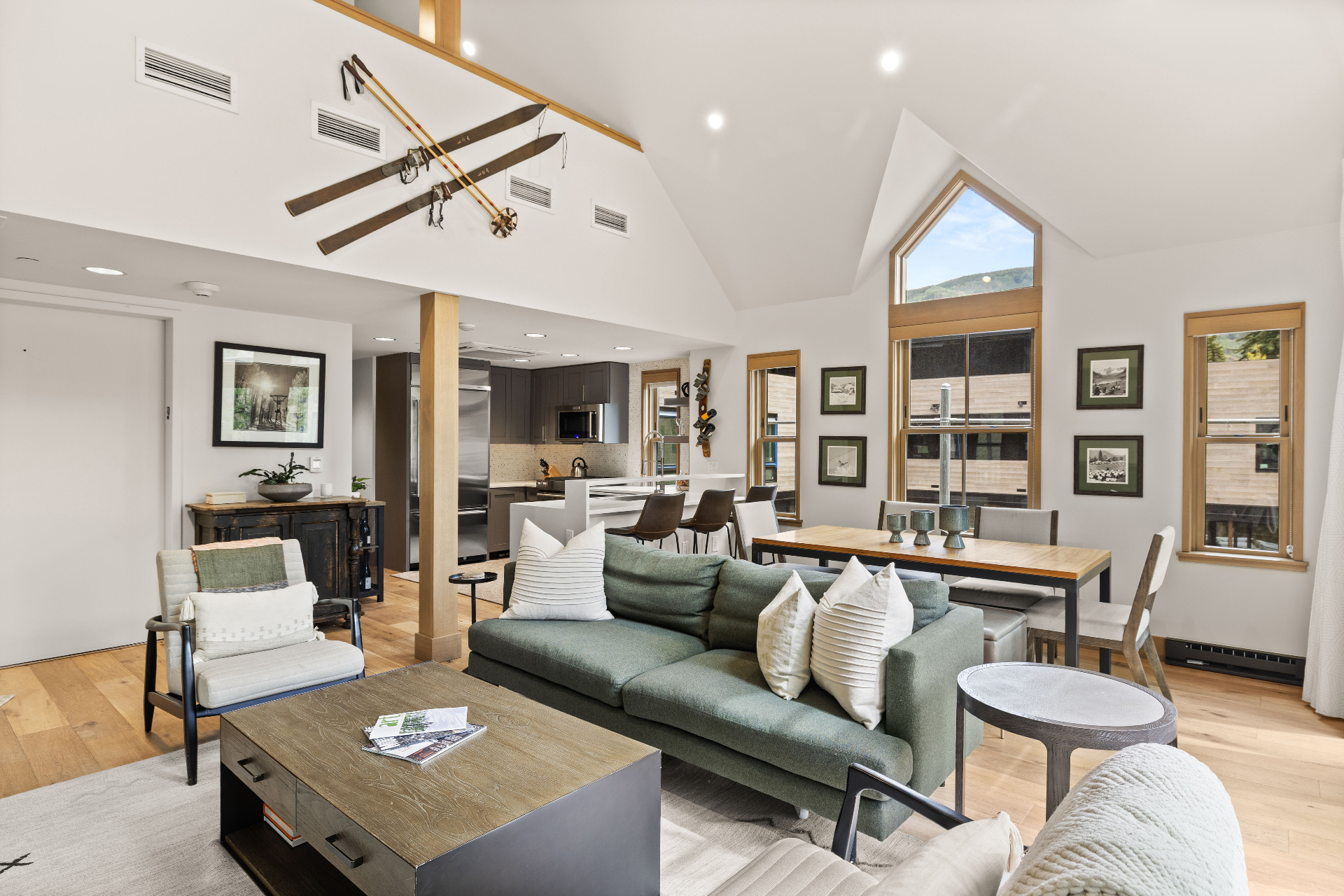 Open-plan living room with vaulted ceilings and mountain views