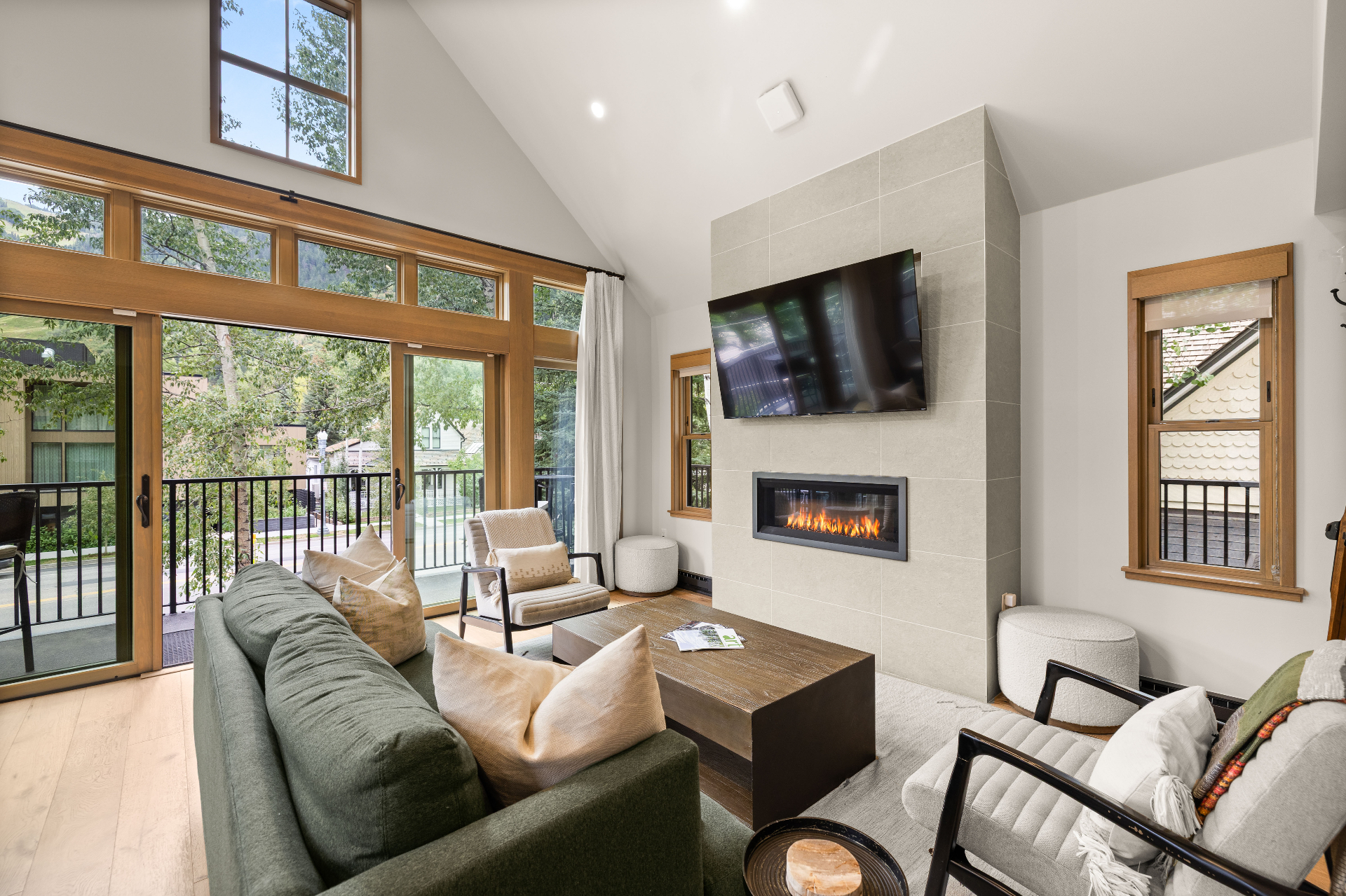 Living area with fireplace and floor-to-ceiling windows